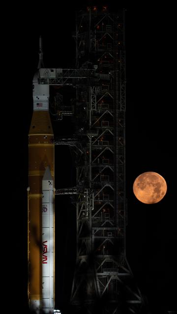 NASA image: Full Moon Rising Over Full Artemis II Stack at Launch Pad 39B 